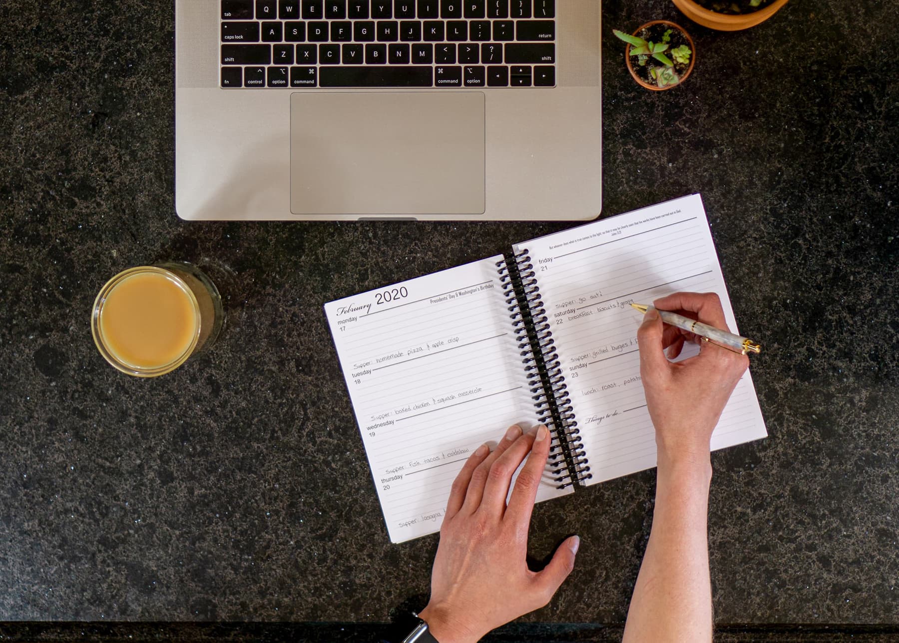 Young Woman Filling Out Weekly Planner