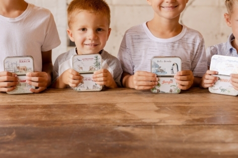 Boys Smiling with Mini Animal Tin Covers