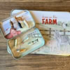 Open Mini Farm Animal tin with animals on top of Large Farm Animal Tin