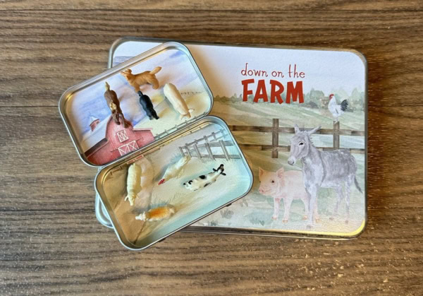 Open Mini Farm Animal tin with animals on top of Large Farm Animal Tin